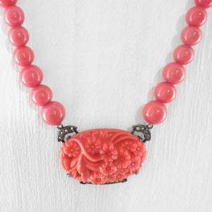 Close-up of Pendent on Art Deco Glass Salmon Coral Bead Necklace 
